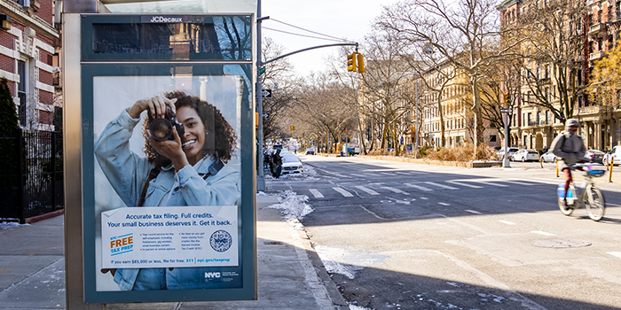 NYC Free Tax Prep ad on a city street
                                           