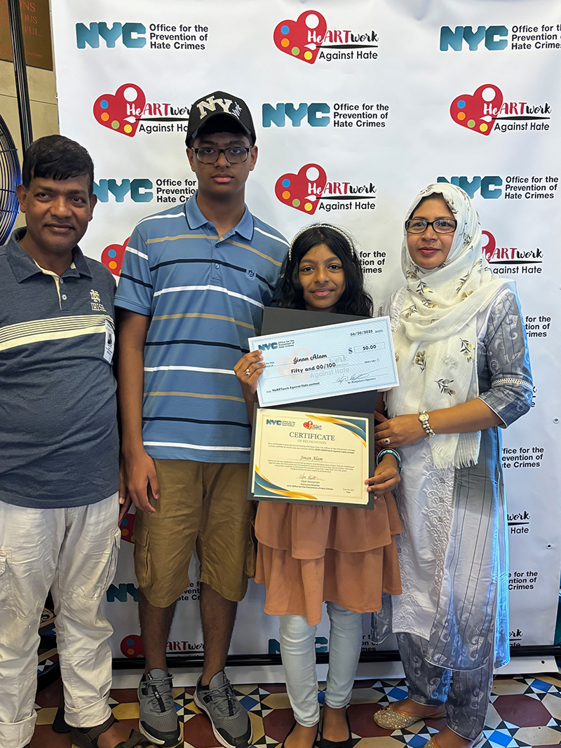 A student winner demonstrated her certificate and check with 3 of her family members