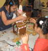 Children at the Jackson Avenue Family Residence in the Bronx decorate a gingerbread house on May 4, 2009