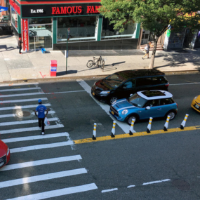 A yellow quick kurb separates traffic lanes on a two way street. 