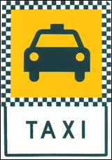 Taxi Stand sign with white and green checkered background.