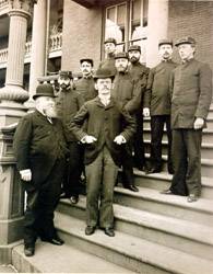 Ambulance Surgeons pose atop the steps of Kings County Hospital, circa 1885