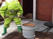 Firefighter in chemical protective suit trains in hazardous material response
