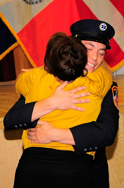 Barbara Schroeder embraces Paramedic Alex Lipsitt, the FDNY EMS member saved her life when she went into cardiac arrest in December 2008.