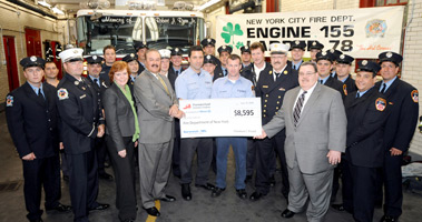 Members from Engine 155 and Ladder 78 receive a $8,600 grant from representatives from Kornreich-NIA and the Fireman�s Fund Insurance Company