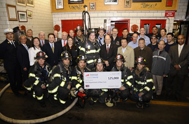 Manhattan Borough Commander Chief Michael Weinlein (far left) and the members of Engine 9/Ladder 6 joined members of the Fireman�s Fund Insurance Company and Curry MacWilliams Janitschke Underwriters, Ltd., for a grant presentation.