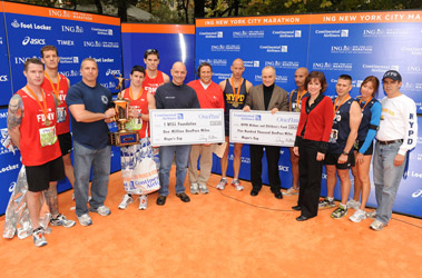 Left to Right: Firefighter Joe Drury of Engine 62, Firefighter Jeff Pellis of Ladder 25, Lieutenant Mike Cacciola of the FDNY Fitness Unit; Firefighter Kieran O'Neill of Engine 218, Firefighter Denis Sweeney of Engine 81 and Chief of Department Salvatore Cassano pictured with Police Commissioner Raymond Kelly and members of the NYPD.