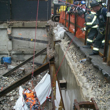 Firefighters perform a high-angle rescue to remove a worker who fell at a construction site. Photo courtesy of Deputy Chief James Daly, Div. 1.