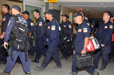 Members of the USAR team return home.