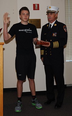 Jacob Knight sworn in as an Honorary Firefighter by Chief of Department Edward Kilduff during his visit in 2011.