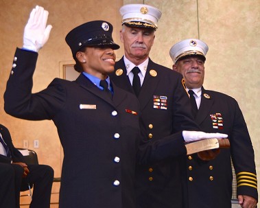 Juliette Arroyo takes the Oath of Office for her promotion to lieutenant, alongside Chiefs Edward Kilduff and Abdo Nahmod.