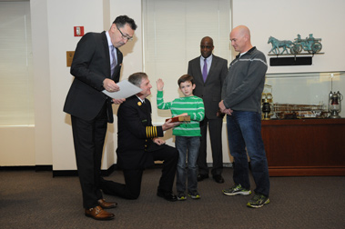 Ryan Zinna takes the Oath of Office, making him an Honorary Firefighter. (L to R) Fire Commissioner Daniel Nigro, Chief of Department James Leonard, First Deputy Commissioner Robert Turner, and Darren Zinna, Ryanâ€™s father.