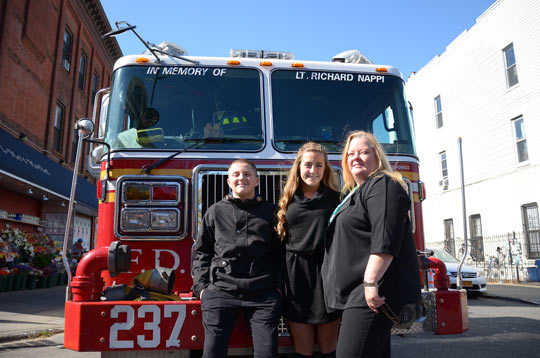 (from left to right) Lt. Richard A. Nappi's son Nicholas, daughter Catherine, and wife Mary Anne.