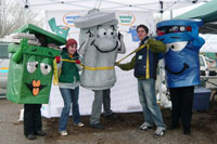 recycling characters with couple at compost giveback event
