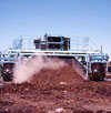 Turning windrows at Fresh Kills composting facility