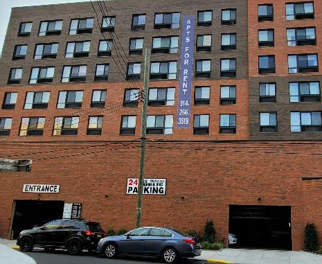 Photo of a buildings with illegal outdoor advertising sign.