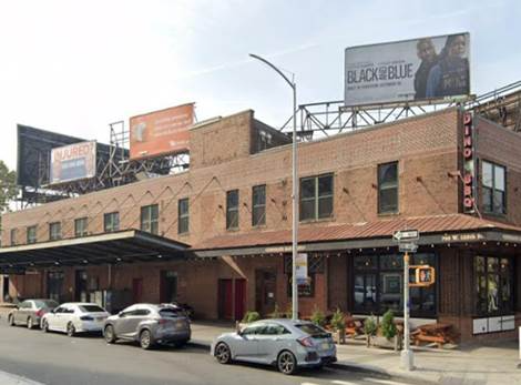 displaying three illegal advertising signs without permits .