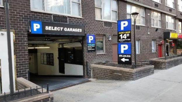 Photo of displaying three accessory signs advertising parking.