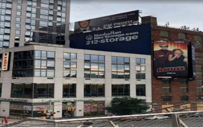 Displaying a rooftop advertising sign without a permit and in a prohibited zone.