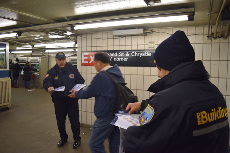 Photos of DOB and FDNY handing out flyers in Flushing-Main Street Station, Queens, and Grand Street Station, Manhattan. All photos courtesy of DOB.