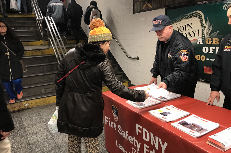 Photos of DOB and FDNY handing out flyers in Flushing-Main Street Station, Queens, and Grand Street Station, Manhattan. All photos courtesy of DOB.