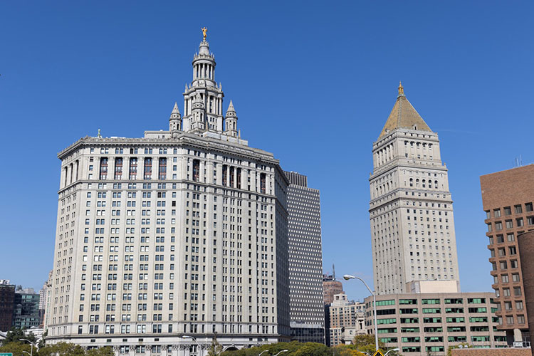 View of the Manhattan Municipal Building from the Brooklyn Bridge.