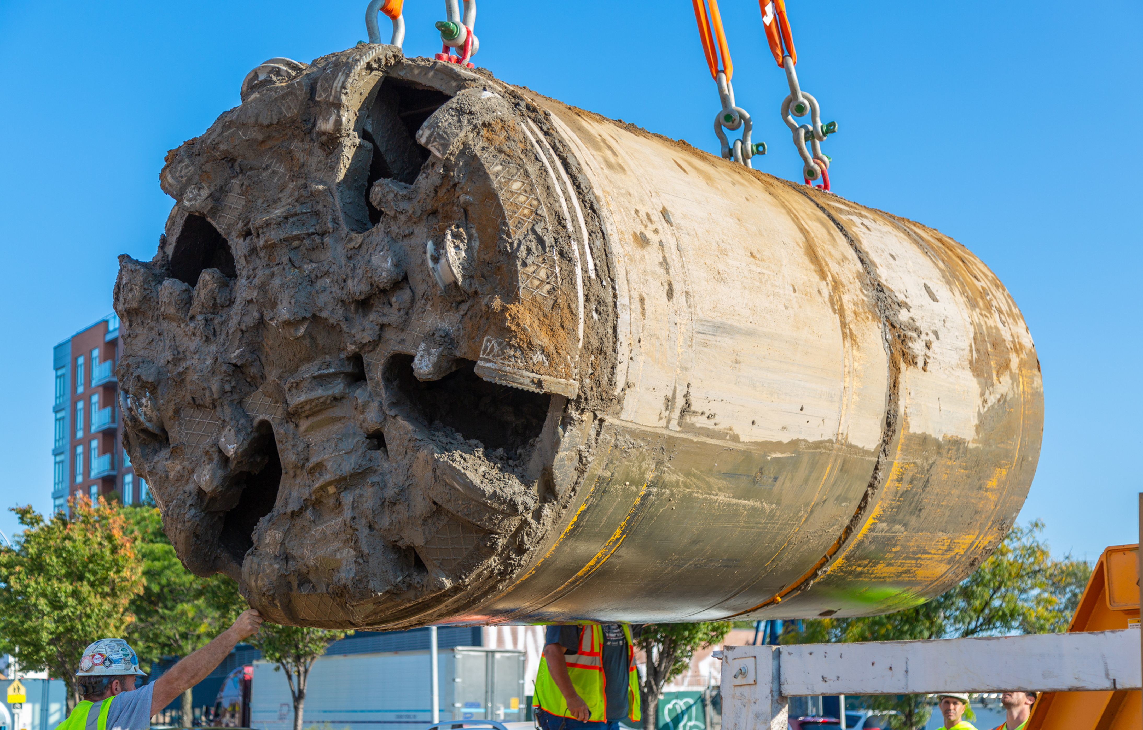 Crew lifting microtunneling machine that allowed for less disruption to residents in Maspeth during construction
                                           