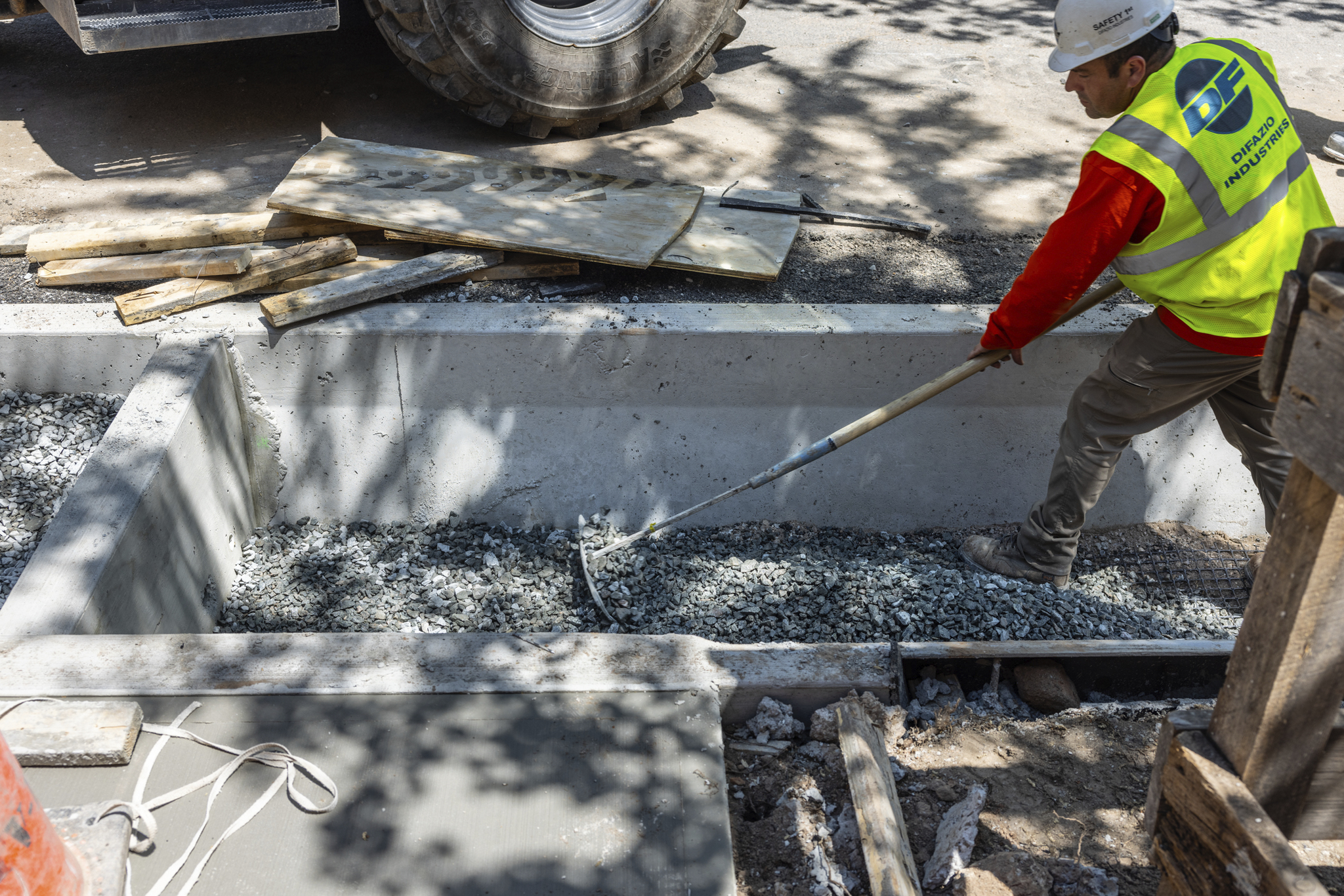 Worker filling hole with rocks