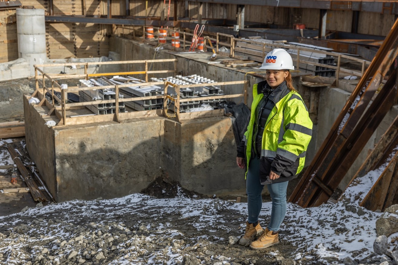 Ketty Paulino posing in construction gear on worksite