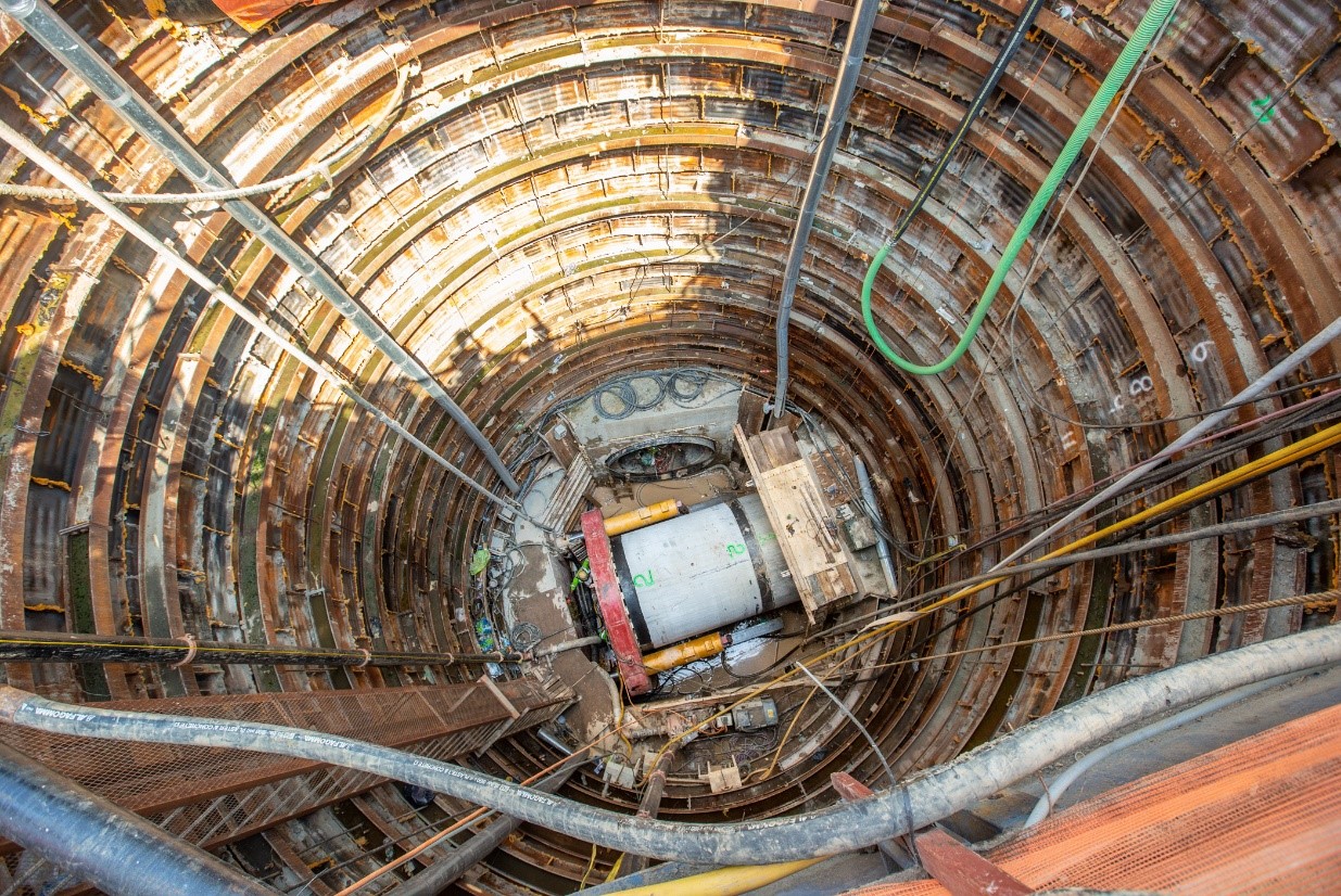 A segment of the new 96-inch diameter sewer is seen at the bottom of a construction shaft before it's put in place inside the new tunnel
