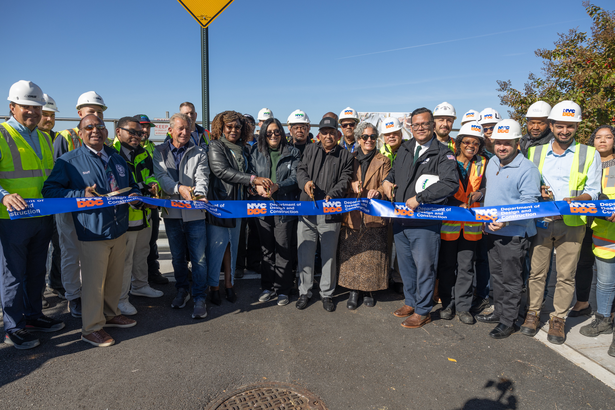 DDC, DEP, DOT, and Office of Queens Borough President staff, as well as Assemblymember Stacey Pheffer Amato, Councilmember Joann Ariola, Dan Mundy of the Broad Channel Civic Association, and Felicia Johnson of Community Board 14 at a ribbon cutting ceremony for Broad Channel Phase II project on October 25, 2024