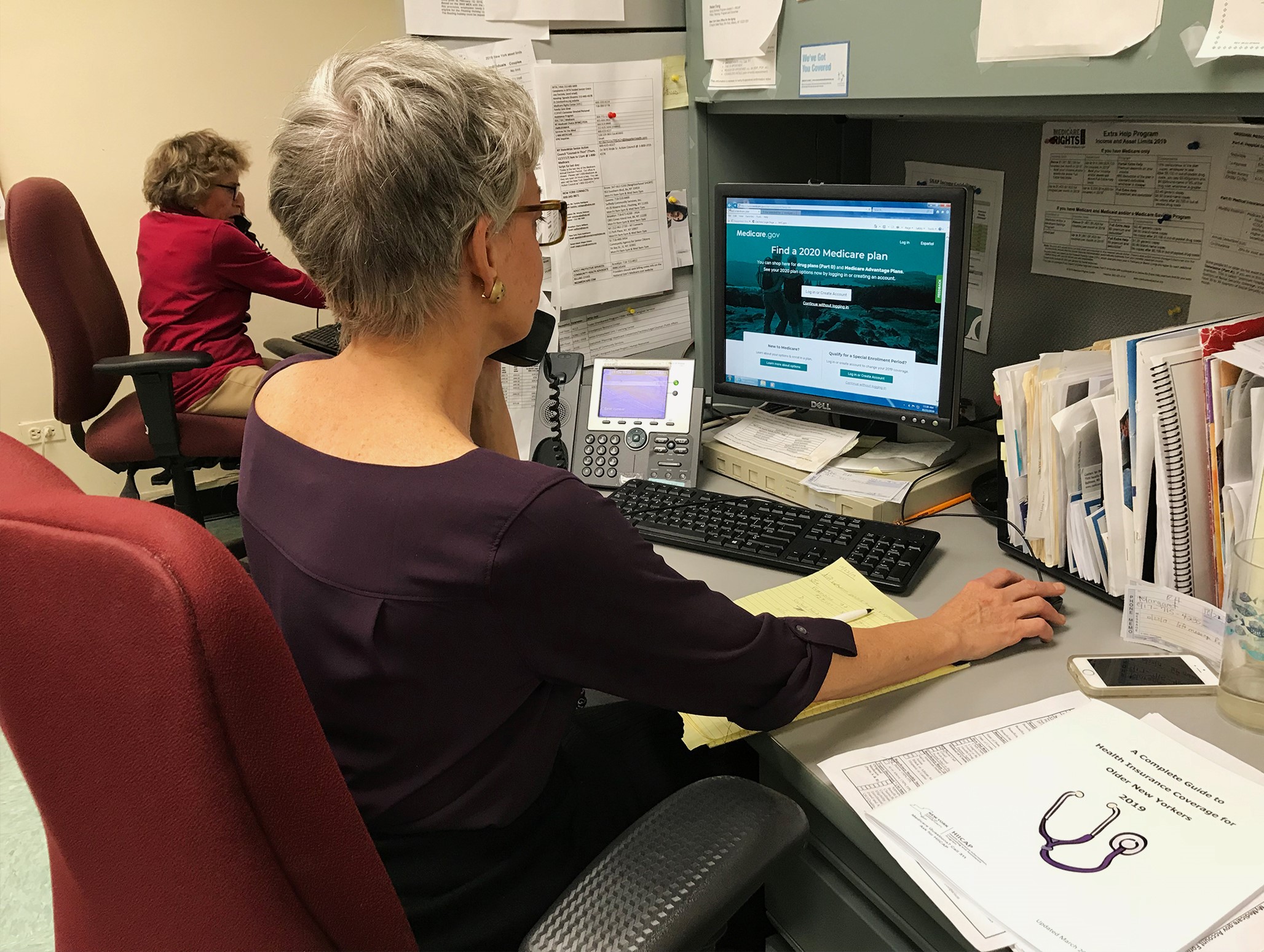 A HIICAP counselor consults a caller over the phone