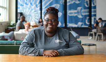 image of young lady sitting at desk