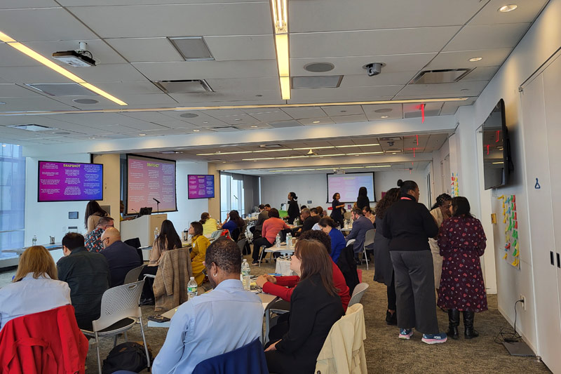 a room full of people participating in the racial equity planning.