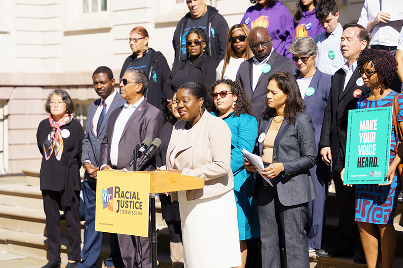 Commissioner Sideya Sherman speaking on the historic steps of City Hall.