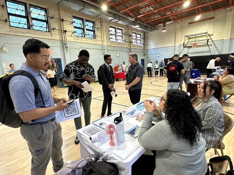 Quarterly information session attendees visit the Coastal Resiliency table