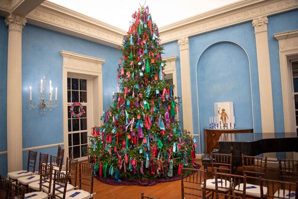 Christmas tree with ribbon decoration in room