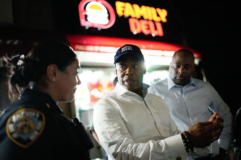 Mayor Adam is speaking to a policewoman.