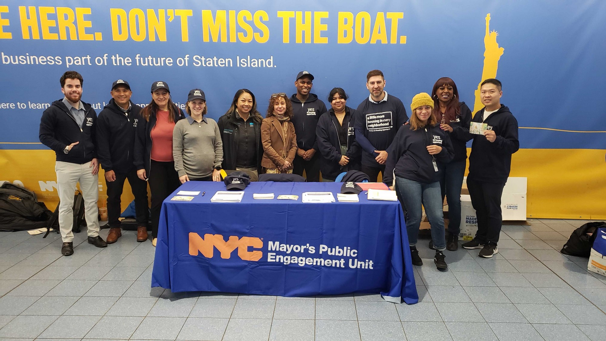 City volunteers, including Deputy Mayor for Operations Meera Joshi, canvassing for City of Yes  at the Staten Island Ferry.