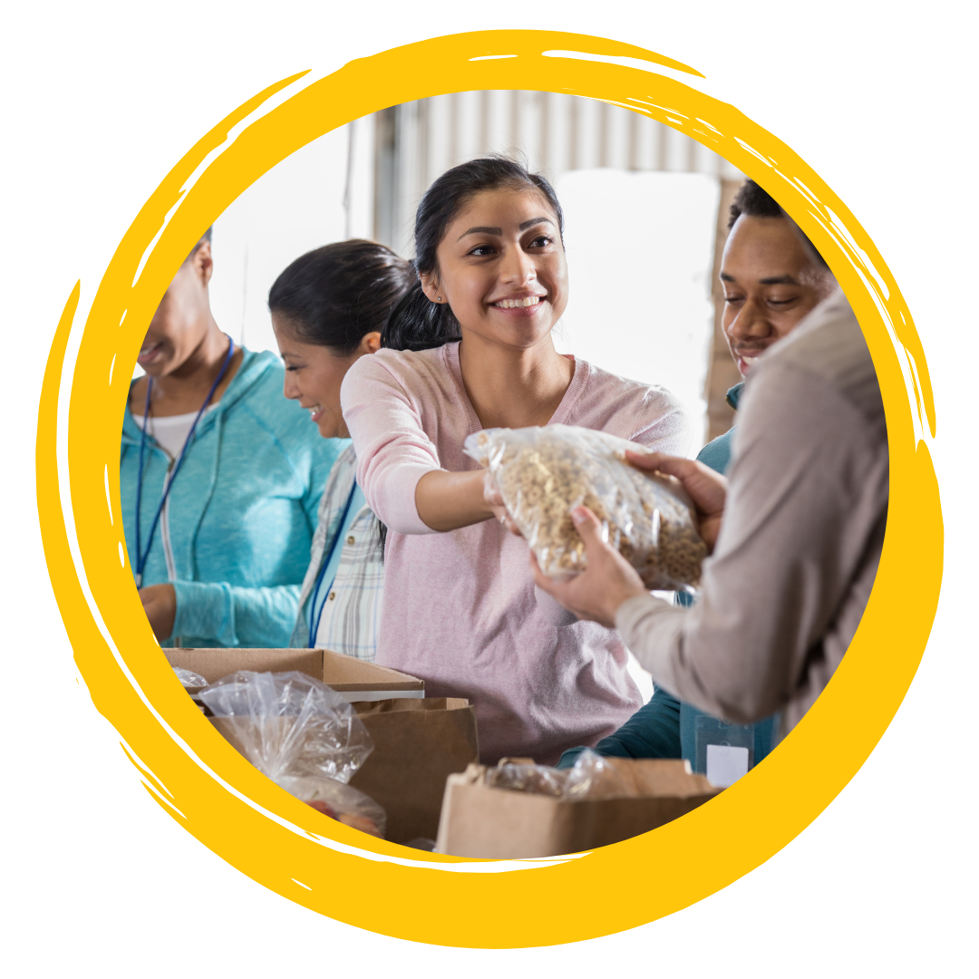 Photo of people smiling while volunteering