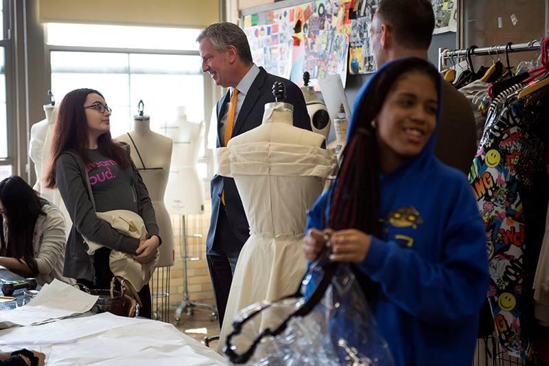 Mayor talking to a young New York employee