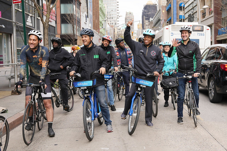 The Mayor on a Citi bike, flanked by other bicyclist on each side