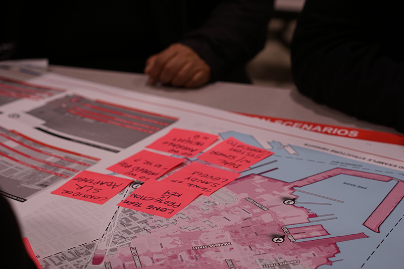 A close up of maps and statistics about the neighborhood of Red Hook