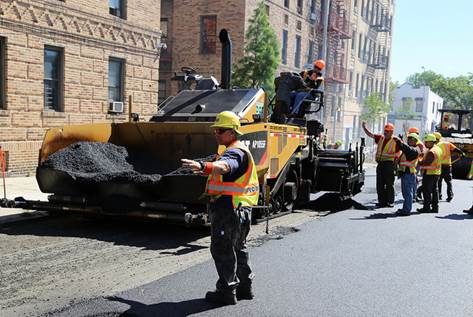 NYC DOT crew paving a street