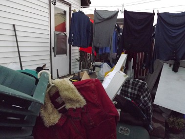 The door in the backyard of the home where firefighters rescued three people.